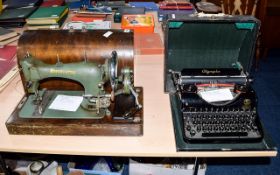 Vintage Olympia Typewriter, together with a table top sewing machine.