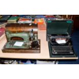 Vintage Olympia Typewriter, together with a table top sewing machine.