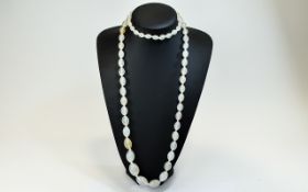 A 1920's - Nice Quality Clear White Agate Beaded Long Necklace. 40 Inches In Length. 165.2 grams.