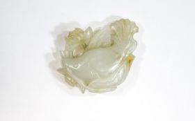 A Chinese Antique White Jade Fish and Lotus Pendant. 38 grams. 2.5 Inches High.