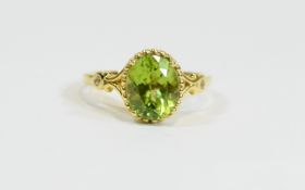 Peridot Solitaire Ring, a 4ct oval cut peridot, set in a millgrain mount in 14ct vermeil and silver,