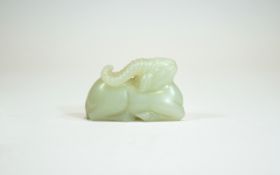A Chinese Qing Dynasty White Jade Lamb. 85.4 grams. 1.5 x 2.25 Inches.