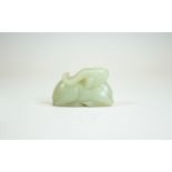 A Chinese Qing Dynasty White Jade Lamb. 85.4 grams. 1.5 x 2.25 Inches.