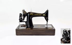 Singer Sewing Machine, with accessories and instruction manual in portable carry case.