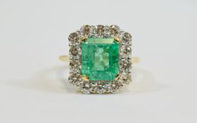 18ct Gold Emerald and Diamond Cluster Ring, The Central Step Cut Emerald of Good Colour,