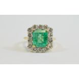 18ct Gold Emerald and Diamond Cluster Ring, The Central Step Cut Emerald of Good Colour,