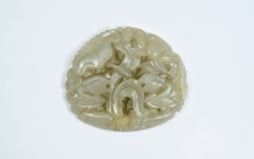 A Pierced Chinese Jade Beli Plaque. 25.9 grams. 1.75 Inches Diameter & 2 Inches. High.