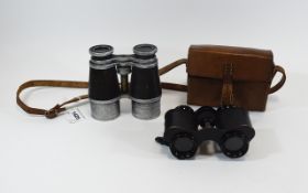Pair of Small French Binoculars, marked high power,prisma, Paris, in leather carry case.