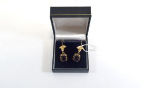 Pair Of Ladies High Carat Gold Drop Earrings, Each Set With A Large Purple/Green Gemstone,