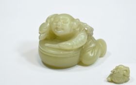 Chinese Antique Jade Carving of a Boy and a Drum. 38.9 grams. 1.5 Inches wide.