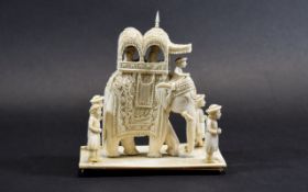 A 19th Century Carved Ivory Group Figure of a Large Robed Indian Elephant with Howdah and 4