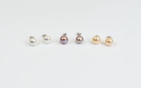 Three Pairs of Fresh Water Cultured Pearl Stud Earrings, comprising one pair each of white,