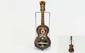 Tortoiseshell Key Wind - Model Musical Guitar with Silver Inlay and of Nice Quality From The 1920's.