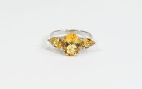 Citrine Three Stone Ring, the central, oval cut stone being 3.