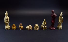 Collection of Faux Ivory Netsukes, one showing a dragon dog, the other four, Immortals,