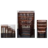 A SET OF CHINESE HONGMU QUARTETTO TABLES EARLY 20TH CENTURY Each with inset panel top and pierced