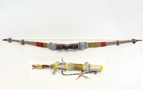 Bow and Arrow with 8 early arrows and carry case. Length of bow 55 inches.