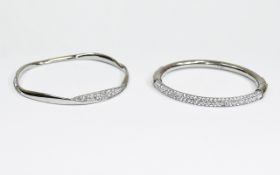 Two DKNY Silver Bangles.