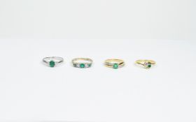 Four Assorted Emerald Set Rings.