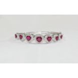 Heart Cut Ruby Bangle, seven graduated r