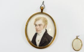 Hand Painted Portrait Miniature of a young gentleman with light coloured complexion, curly hair,