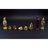 Collection of Faux Ivory Netsukes, one showing a dragon dog, the other four, Immortals, plus two