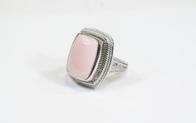 Pink Opal Cabochon Ring, an elongated cushion cut cabochon of pink opal, measuring 11.75cts, bezel