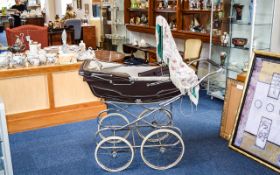 A Traditional Large Silver Cross Pram with sun canopy.