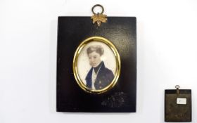 Victorian Hand Painted Oval Miniature on ivory of a young gentleman within a black ebonised frame.