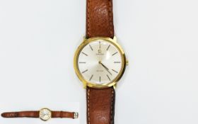 Omega De Ville Manual Wind Gold Plated Wrist Watch circa 1970. Attached to a tan leather strap.