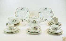 Phoenix China Part Teaset comprising teapot, sugar bowl sandwich plates, cups, saucers and side