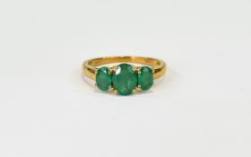 Emerald Three Stone Ring, an oval cut emerald of 1.