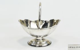 Victorian Shaped Silver Swing Handle Sweetheart Basket, hallmark Birmingham 1898, 4.75 inches high.