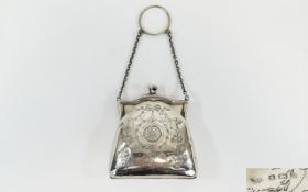 A Small Slver Opera Purse with silver chain attached, the body with chased decoration and garlands.