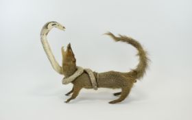 Taxidermied Mongoose And Cobra Vintage taxidermy of Mongoose in battle with Cobra,
