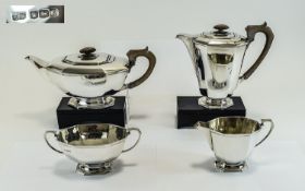 George VI 4 Piece Silver Tea Service, Art Deco lines. Hallmark Sheffield 1943, Makers F.C. Water Jug