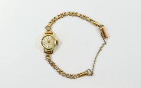 14ct Gold Ladies 1950's Mechanical Wristwatch with integral 9ct gold fancy bracelet.