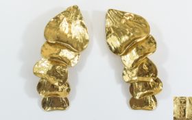 Yves Saint Laurent Vintage Earrings Clip on earrings in gold tone metal.