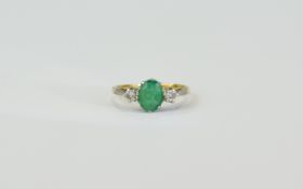 18ct Gold Set Emerald and Diamond 3 Stone Ring. The Central Emerald Flanked by Diamonds.