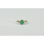18ct Gold Set Emerald and Diamond 3 Stone Ring. The Central Emerald Flanked by Diamonds.