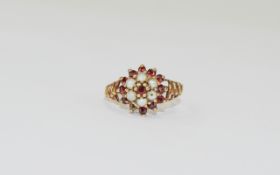 A Ladies Vintage 9ct Gold Set Garnet and Seed Pearl Cluster Ring. Fully hallmarked. Ring size P. 3.