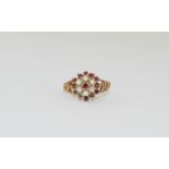 A Ladies Vintage 9ct Gold Set Garnet and Seed Pearl Cluster Ring. Fully hallmarked. Ring size P. 3.
