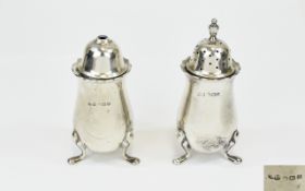 George V Pair of Silver Pepperette And Salt Pots each raised on 3 splayed feet,