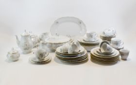 Modern Dinner Service, floral decoration on white ground, Comprises tureens, dinner plates, cups,