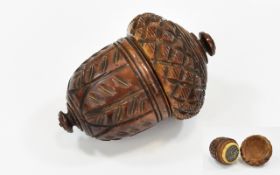 A Superb German Carved Coqvilla Nutmeg Grater of acorn form, the screw off lid with notched edge,