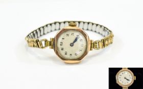 Ladies 9ct Gold Cased Octagonal Shaped Wrist Watch attached to a gold plated bracelet.