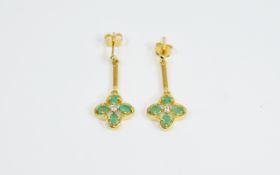 Emerald Quatrefoil Drop Earrings, each earring comprising four oval cut emeralds,