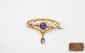 Victorian Period 9ct Gold Openwork Brooch set with amethysts. Marked 9ct. 1.5 inches wide.