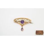 Victorian Period 9ct Gold Openwork Brooch set with amethysts. Marked 9ct. 1.5 inches wide.