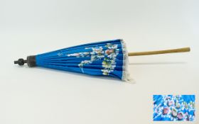 Parasol Vintage Chinese decorative parasol with hand painted floral design and white fringing.